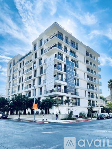 A white building with a blue sky in the background.