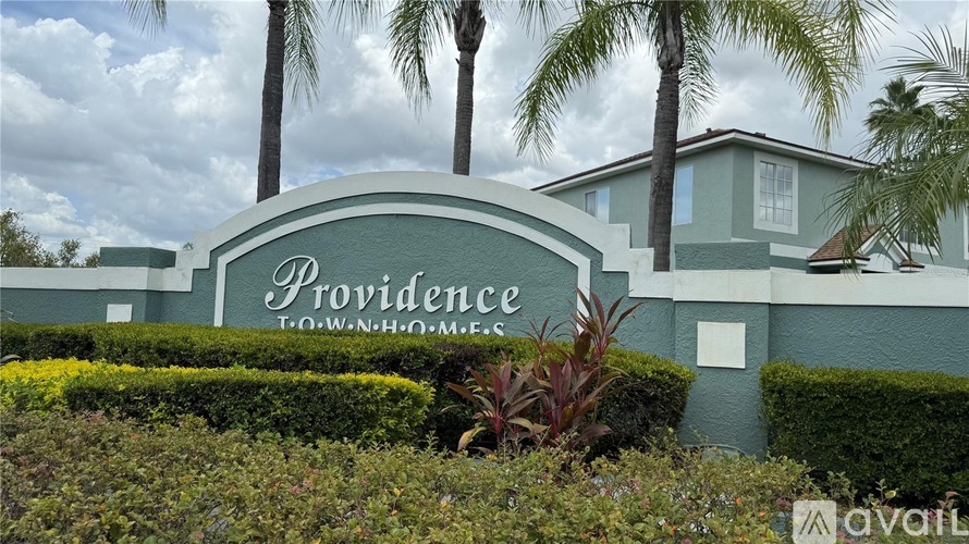 A sign that says Providence in front of a building.