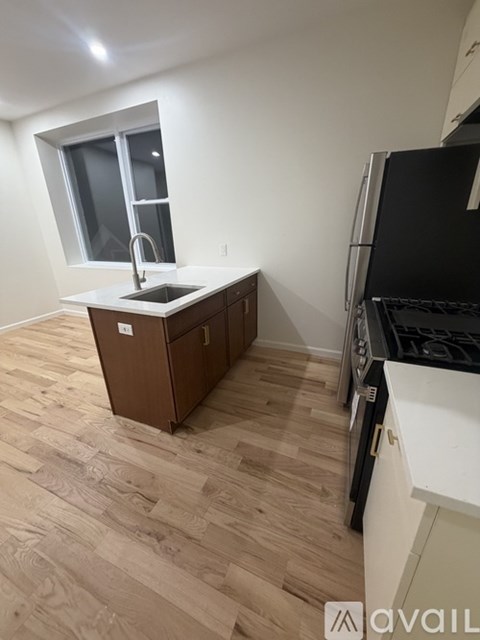 A kitchen with a sink and a window.
