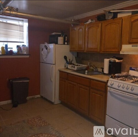 A kitchen with a white refrigerator and a white stove.