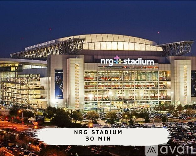 NRG Stadium is a large, modern building with a curved glass facade and a distinctive roof structure.