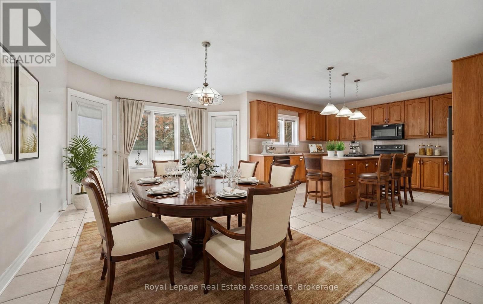 A spacious kitchen with wooden cabinets and a central island.