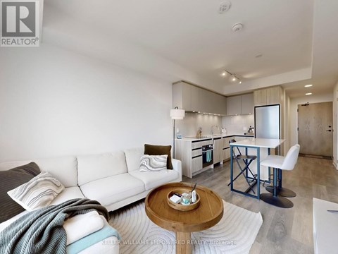 A modern living room with a white sofa and a coffee table.