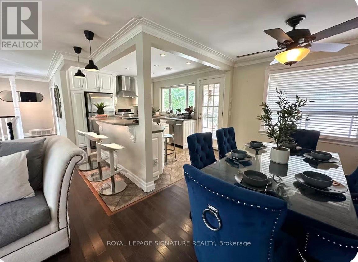 A well-lit dining area with a table set for six.