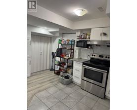 A kitchen with a stove top oven and a microwave.