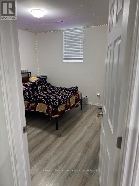 A bedroom with a bed and a window.