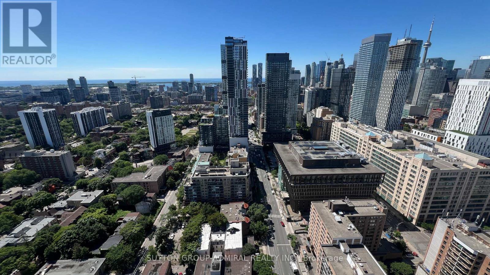 A cityscape with tall buildings and a clear sky.
