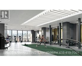 A gym with a woman exercising on a rowing machine.