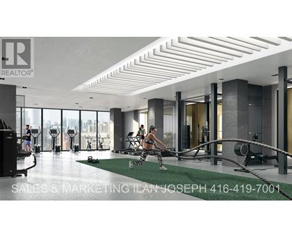 A gym with a woman exercising on a rowing machine.