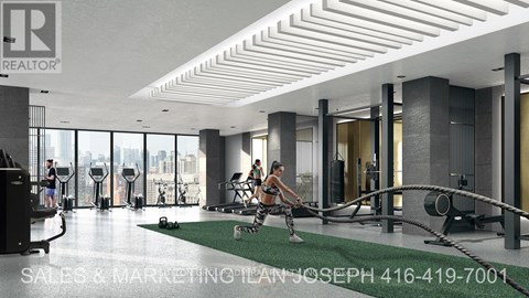 A gym with a woman exercising on a rowing machine.