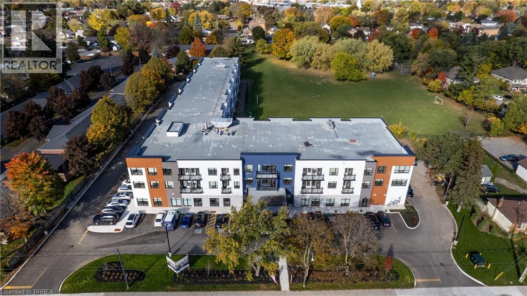 A large building with a parking lot in front of it.