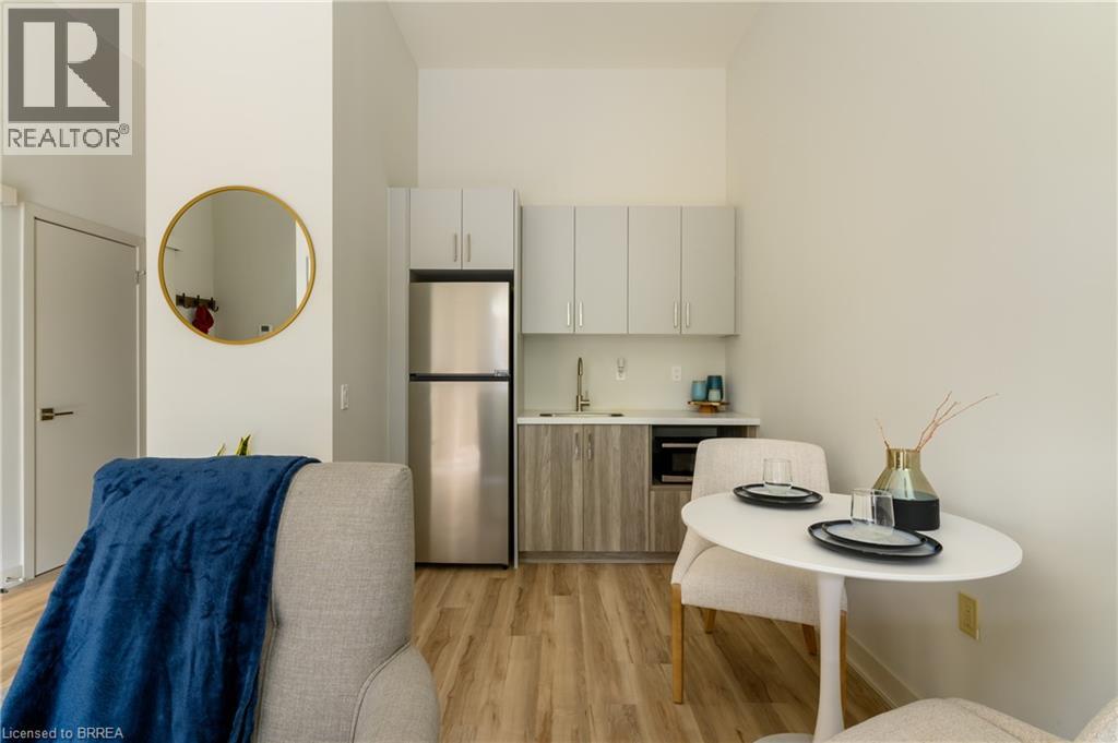 A modern kitchen with a dining table and chairs.