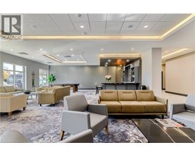 A living room with a couch, chairs, and a coffee table.
