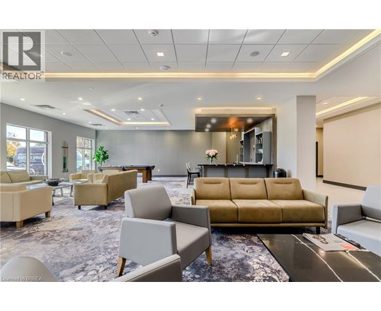 A living room with a couch, chairs, and a coffee table.
