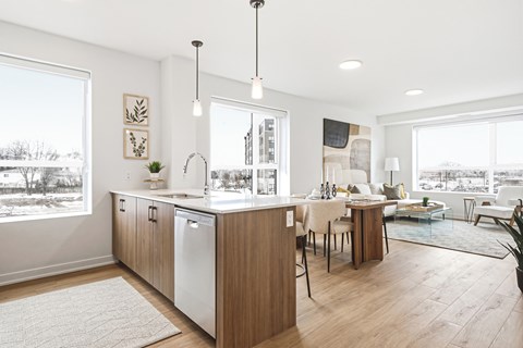 A modern kitchen with wooden cabinets and a large island.