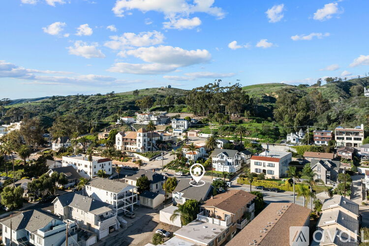 A bird's eye view of a residential area with houses and trees.