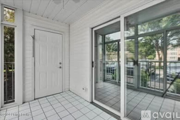 A white door is on the left and a glass door is on the right.