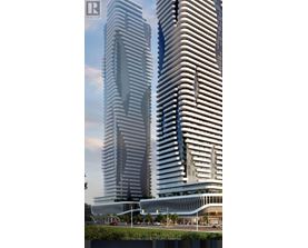 Two tall buildings with a curved design are shown in the image.