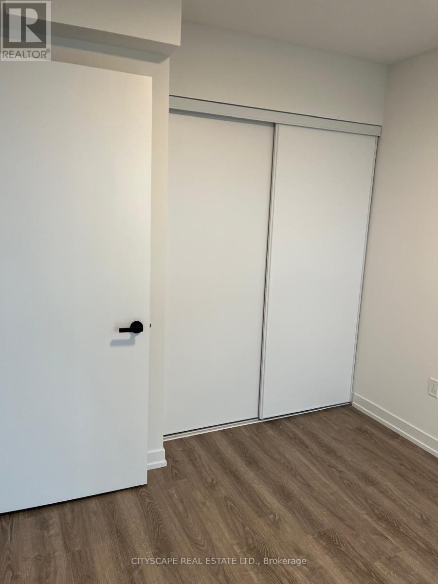 A white door is on the left and a white closet door is on the right.
