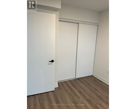 A white door is on the left and a white closet door is on the right.