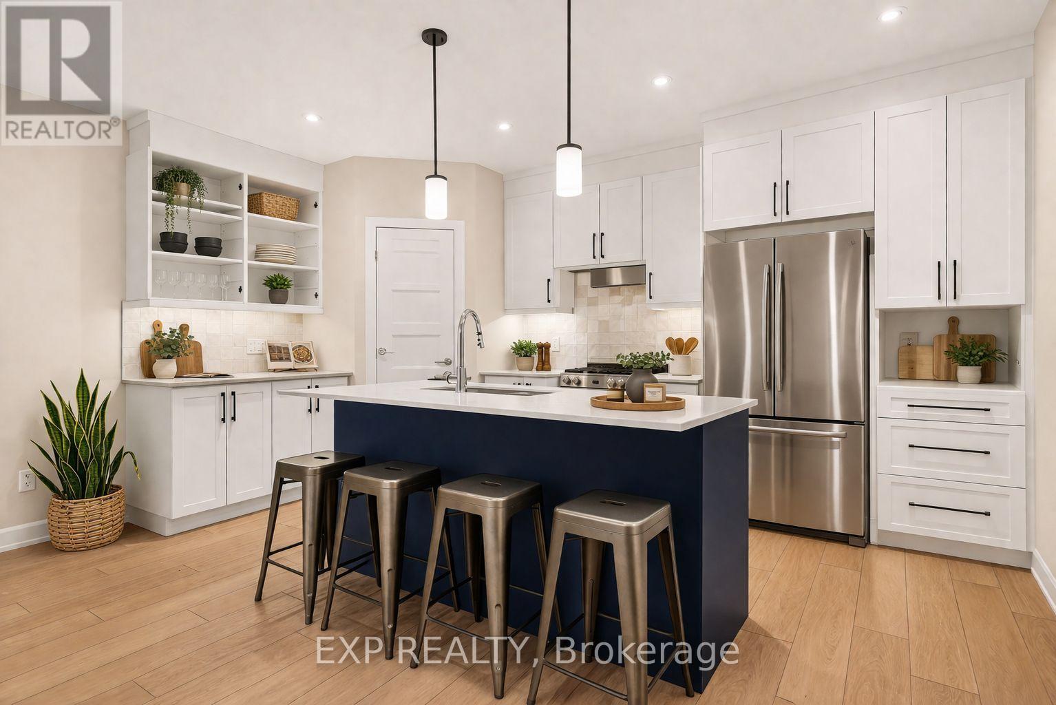 A modern kitchen with white cabinets and a blue island.