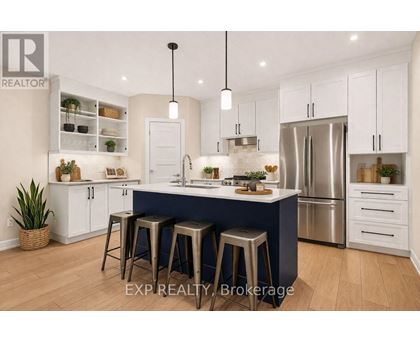 A modern kitchen with white cabinets and a blue island.