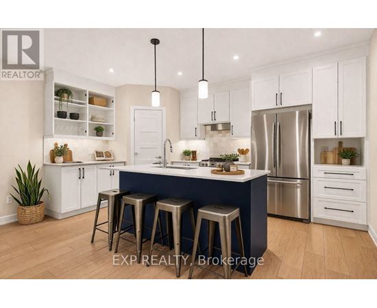 A modern kitchen with white cabinets and a blue island.