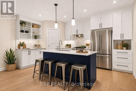 A modern kitchen with white cabinets and a blue island.