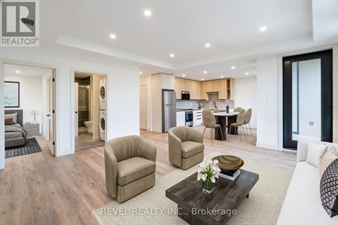 A modern living room with a brown armchair and a coffee table in the center.