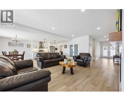 A living room with brown leather couches and a wooden coffee table.