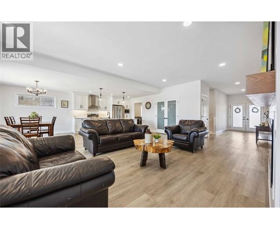 A living room with brown leather couches and a wooden coffee table.