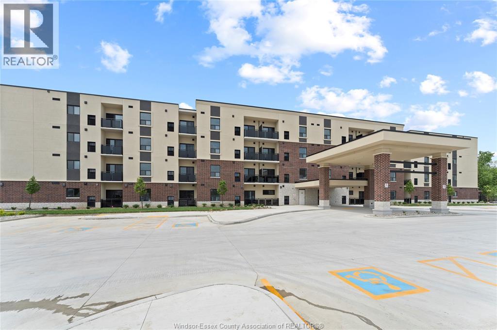A large building with a parking lot in front of it.