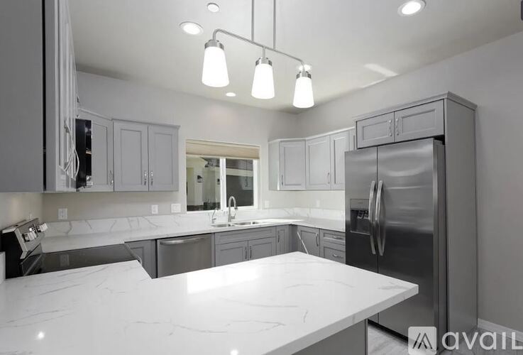 A modern kitchen with a large island in the center.