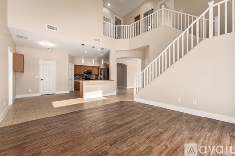 A kitchen with wooden cabinets and a white dishwasher.