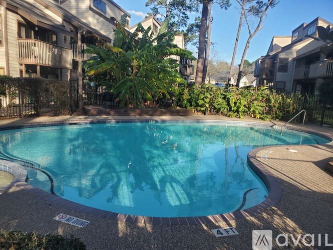 A swimming pool surrounded by apartment buildings.