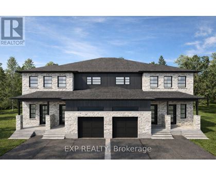 A modern house with a stone facade and a large front yard.