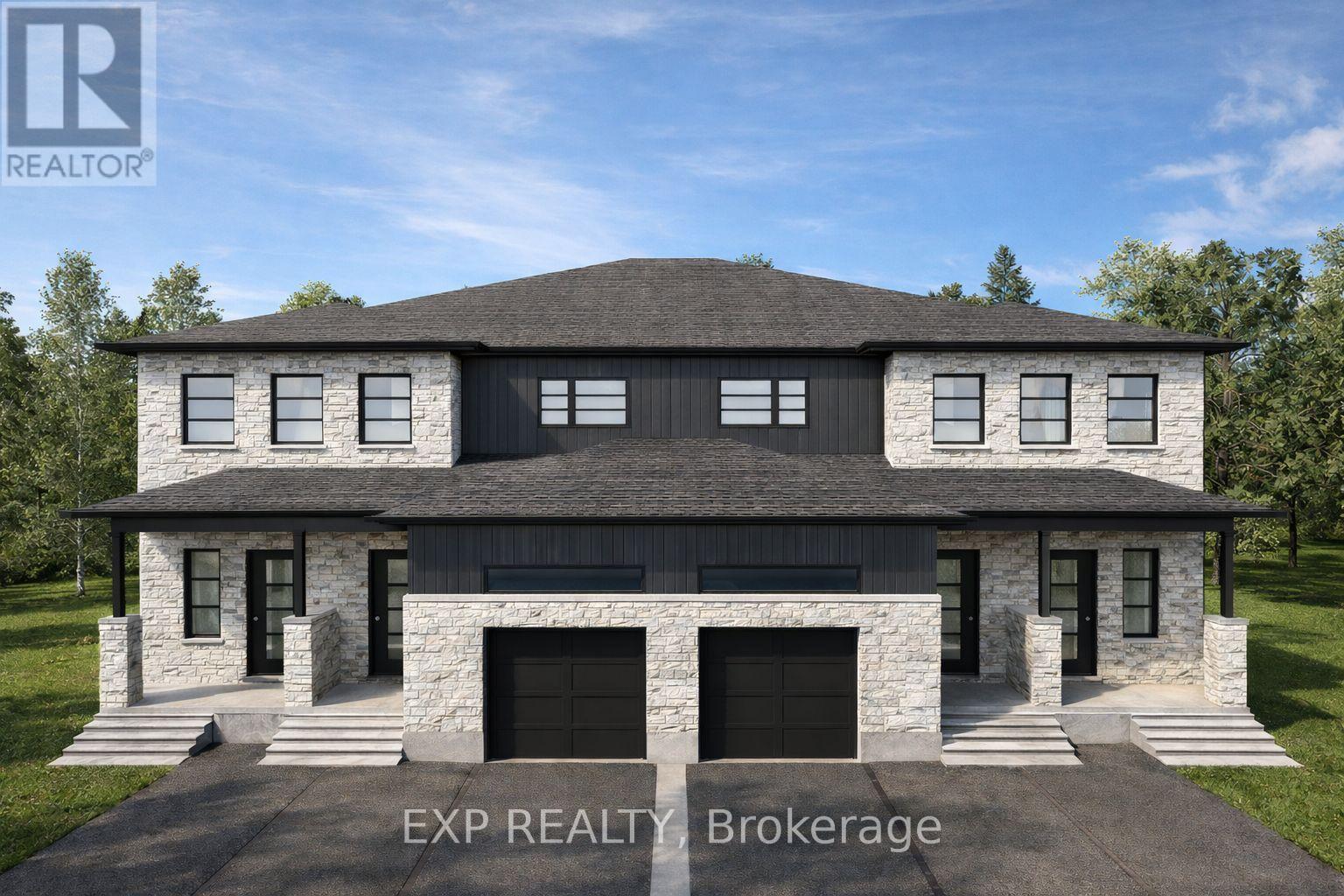 A modern house with a stone facade and a large front yard.