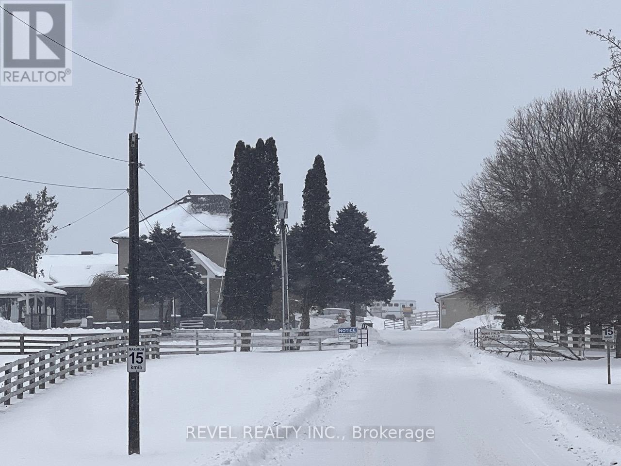 A snowy street with a sign that reads 15.