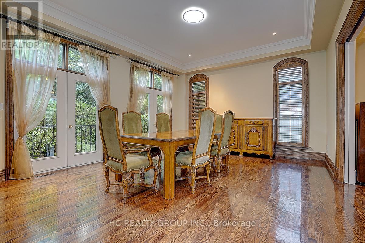A dining room with a table set for six.
