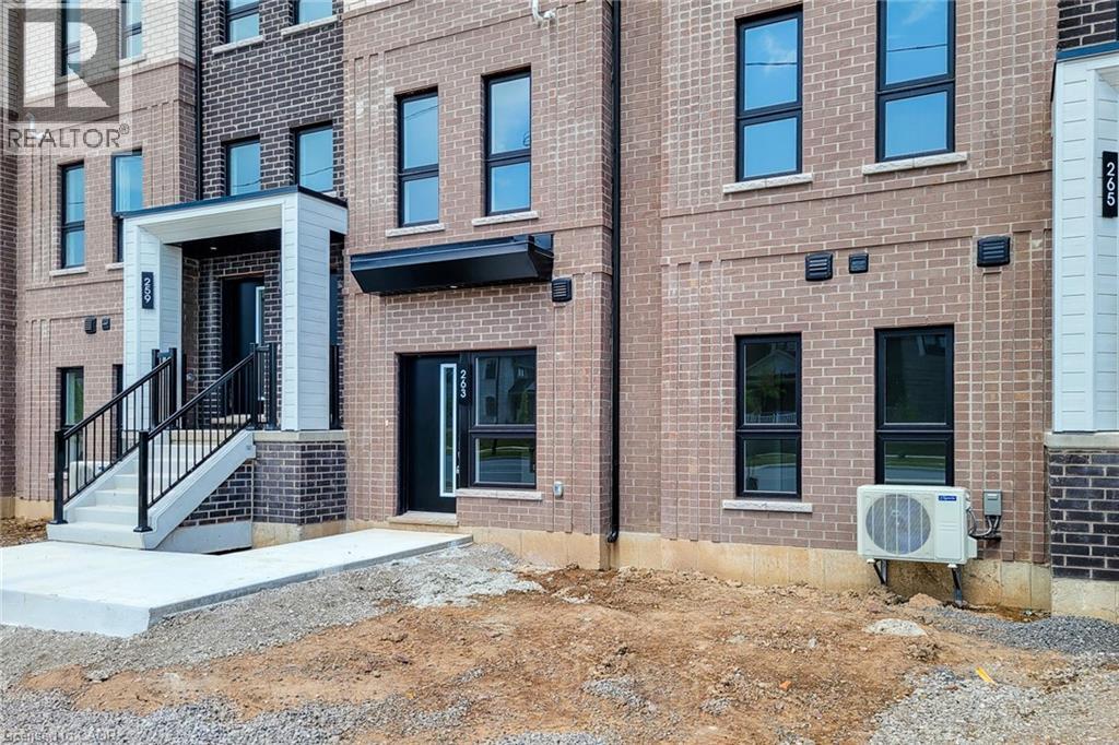 A building with a black and white entrance and a sign that says REALTOR.