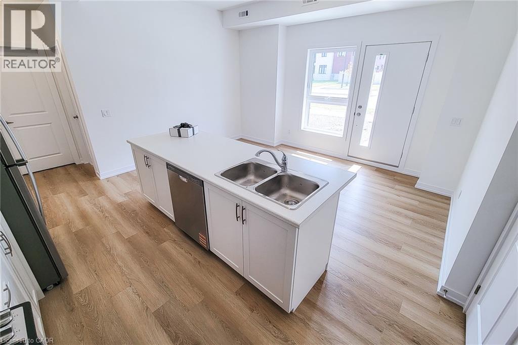 A kitchen with a sink and a window.