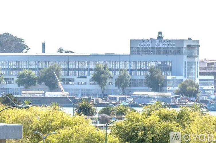 A large building with the words "Naval Shipyard" on it.