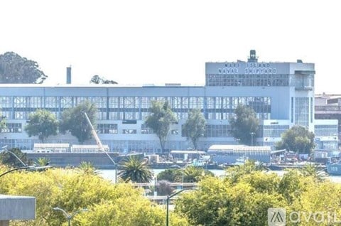A large building with the words "Naval Shipyard" on it.