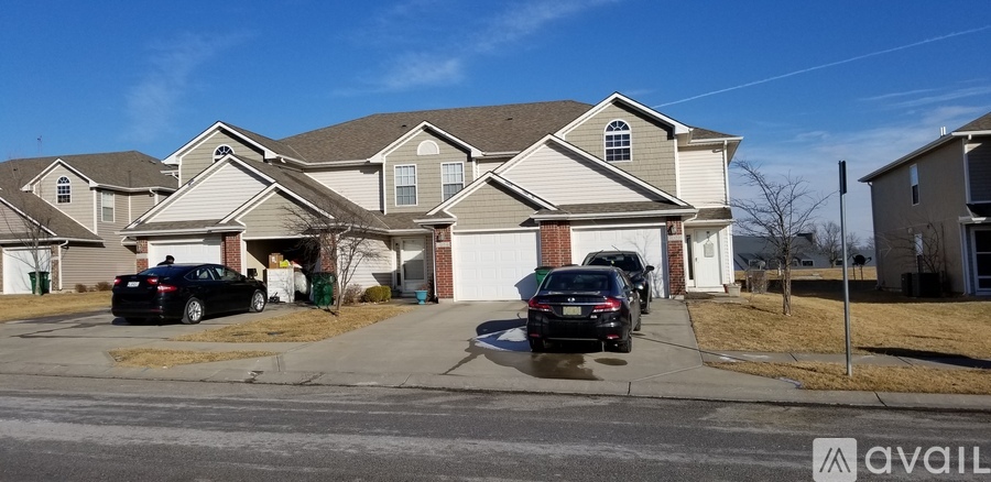 A house with a car parked in front of it.