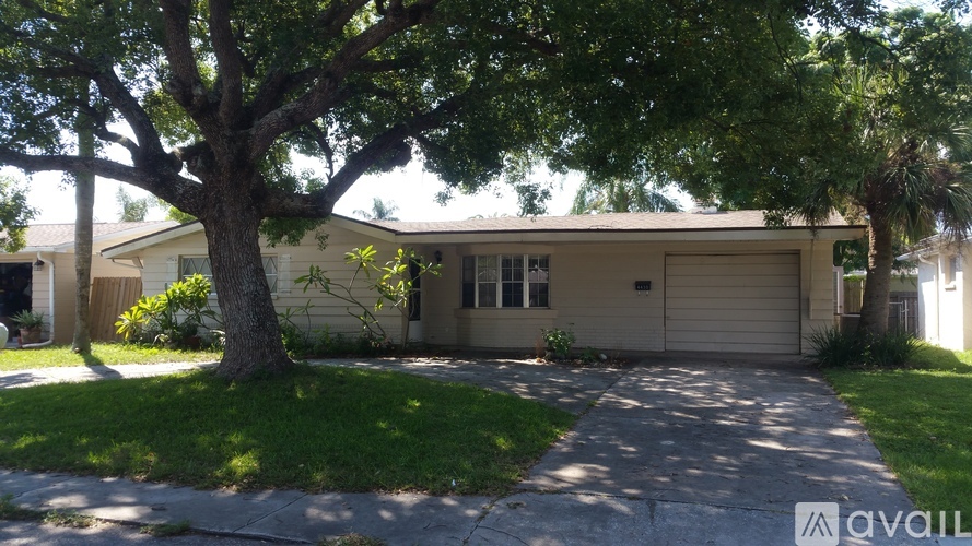 A house with a tree in front of it.