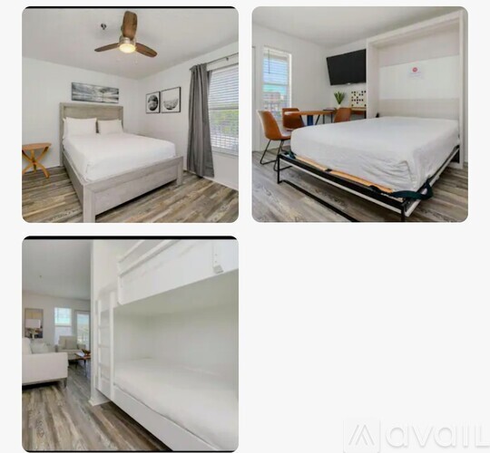 A bedroom with a bed, a chair, and a ceiling fan.