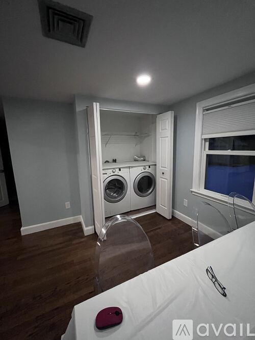 A laundry room with a washer and dryer in it.