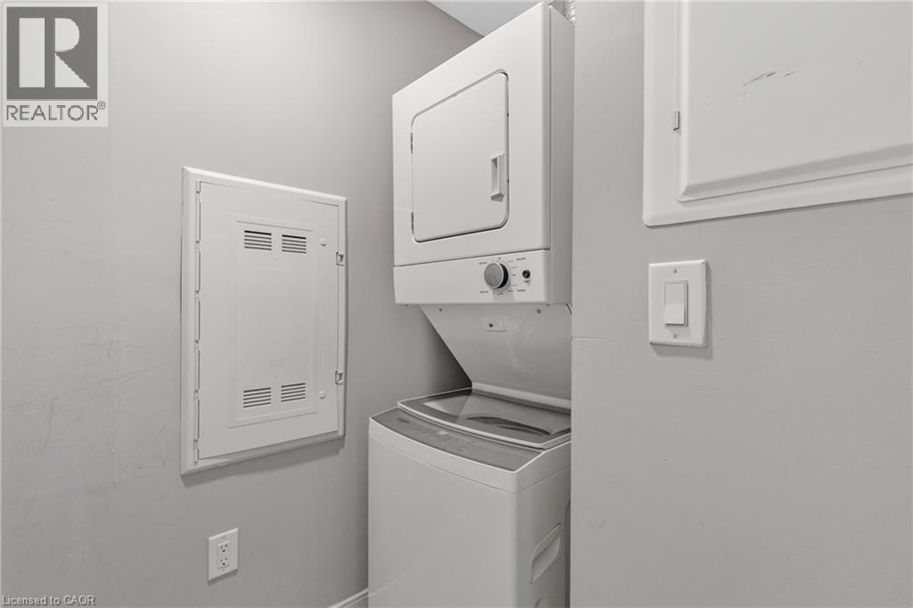 A white dishwasher and dryer in a kitchen.