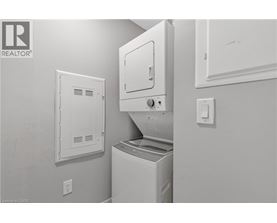 A white dishwasher and dryer in a kitchen.