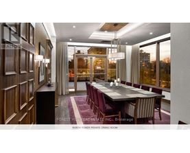 A dining room with a long table and chairs.